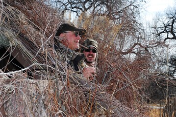 Waterfowl hunter in a blind