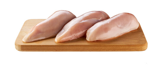 raw skinless chicken breast fillets on a cutting board isolated on white background.