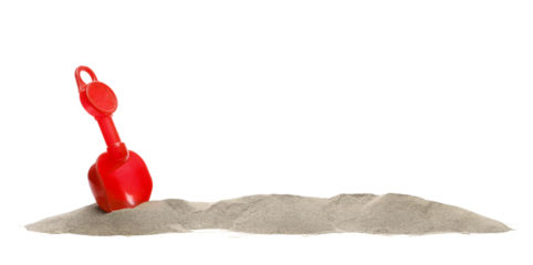 Beach toy for kids, plastic shovel in sand pile isolated on white, side view, clipping path