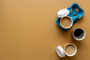 Different types of coffee to go in paper cup with cup holder