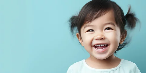 Fotobehang Little cute asian baby blue background. Place for text. Generative AI © 22_monkeyzzz