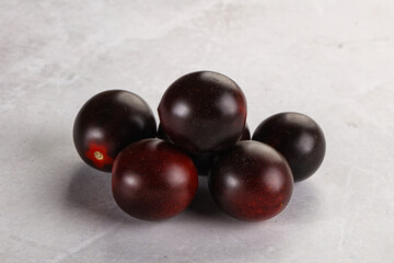 Raw ripe black kumato tomato