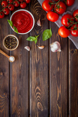 Obraz na płótnie Canvas Homemade tomato passata for pasta with tomatoes and basil