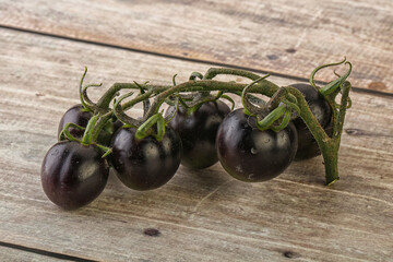 Ripe tasty black cherry tomato