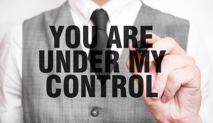 YOU ARE UNDER MY CONTROL word made by marker and hand