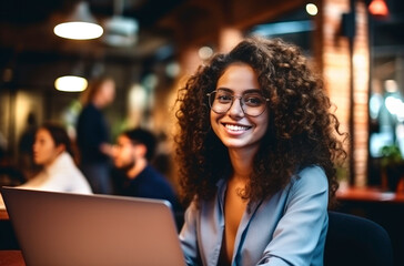 Smiling Latina brunette architect making a work call with a laptop from a coffee shop. AI Generated