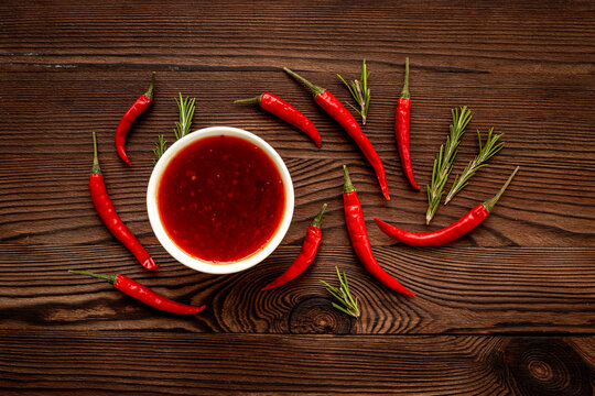 Spicy seasoning - red chili pepper and sauce, top view