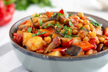 Homemade Eggplant Potato Tomato Stew with Parsley in a Bowl, side view.