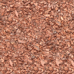 Seamless pattern texture of natural cortex tree shavings. Wooden pieces on ground.