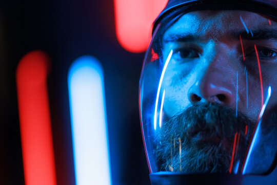 Portrait of futuristic astronaut.  conception. Augmented reality game, future technology, astronomy, AI concept. Neon blue and red light. Dark background.