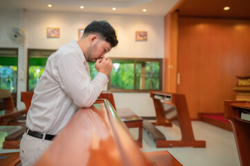 Christian man asking for blessings from God,Asian man praying to Jesus Christ
