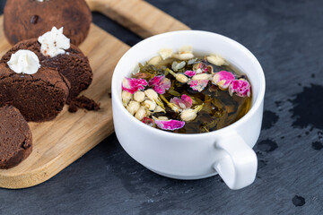 green tea with rose and jasmine flowers