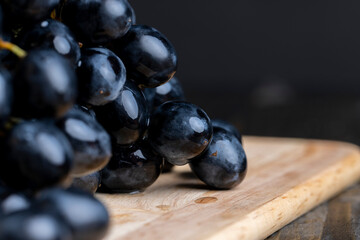 Unwashed blue grapes in the dust