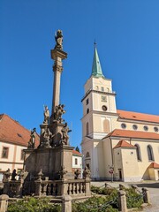 Fototapeta premium Rokycany historical city center,old town square with fountain and tall column, town hall building and catholic church,Bohemia,Czech republic,Czechia,Europe