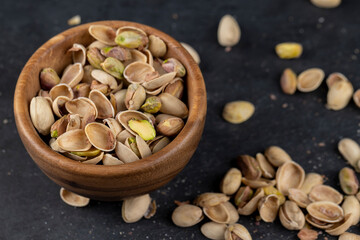 a large number of salty and crispy pistachios close-up