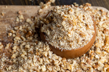 Crushed dried walnuts on the table