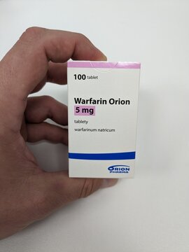 Prague,Czech republic – May 23 2023 : Pharmacy store-Packet of Warfarin Tablets, used to thin blood in patients who are at risk of blood clots which can cause strokes and heart diseases.