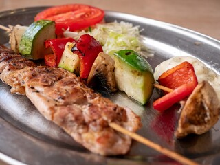 Fresh and healthy food: grilled meat with grilled vegetables and salad. Healthy eating and well-being on the dining table