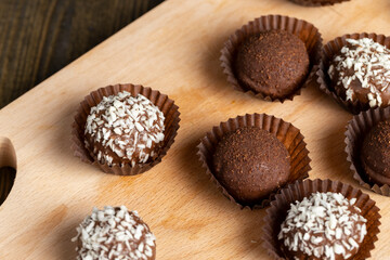 Chocolate candies with coconut flavor and filling
