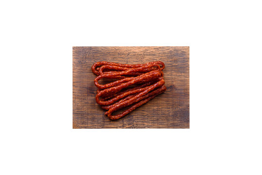Delicious thin smoked meat sausages with spices and herbs