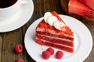 Red cake with cream and raspberry flavor