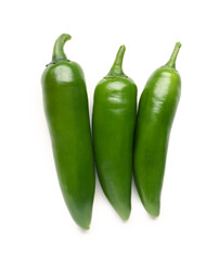 Green chili peppers on white background