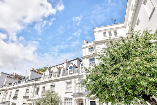 London, England - July 11, 2023: Walk up apartment buildings in Mayfair and Knightsbridge seen from the street in London
