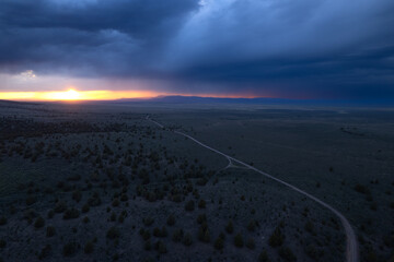 Storm over the plains at sunset