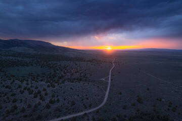 Storm over the plains at sunset