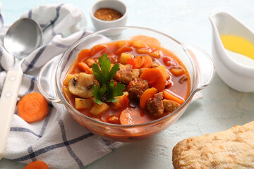 Pot of tasty beef stew on white background
