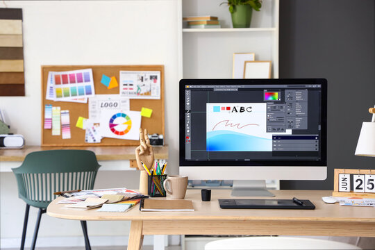 Interior designer's workplace with computer in office