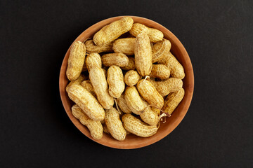 Roasted peanuts, peanuts in shell Isolated on black background