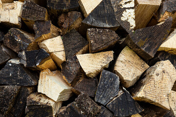 Pile of chopped wood. Firewood stacked to dry.