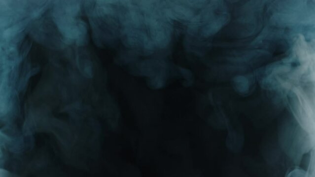 Colored smoke transition on black background