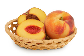 Ripe peach fruit with half in a wicker basket isolated on white background with full depth of field