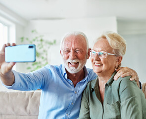 senior woman man couple elderly love elderly selfie camera mobile phone smartphone photo picture portrait male old together active vitality cell phone hug