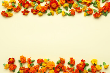 Marigold flowers on pale yellow background. Divaly celebration