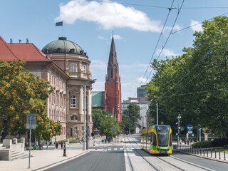 Summer cityscape of Poznań, Wielkopolska, Poland. In the photo: Modern tram at Fredry street,...