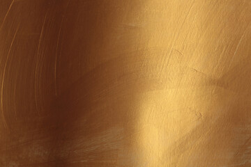 Naklejka premium Bronze and gold ink smear brush stroke stain blot glow texture wall background.
