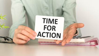 Business Woman holding brochure with Time For Action text on white background.