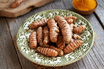 Fresh turmeric root on a plate