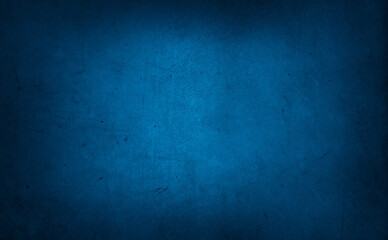 Blue textured concrete wall background. Dark edges