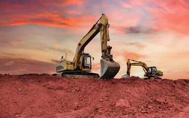 Excavator on earthmoving at open pit mining. Backhoe dig ore in quarry on sunset. Heavy...