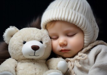 Sleepy newborn baby in a white knitted hat and bear