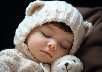 Fototapeta na wymiar Sleepy newborn baby in a white knitted hat and bear
