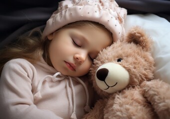 Kid sleeping with a stuffed bear