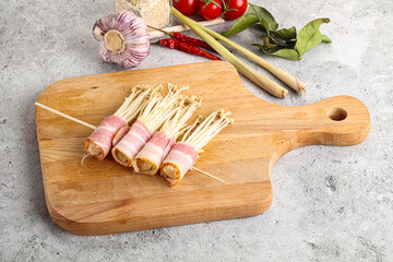 Raw Enoki mushroom with bacon