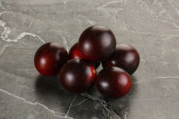 Raw ripe black kumato tomato