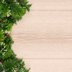 Fototapeta na wymiar Christmas holiday background with empty wooden board . tree branches on a light wooden background. Flat lay. copy space