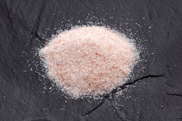 Fine grains of pink Himalayan salt, powder red rock salt from Pakistan